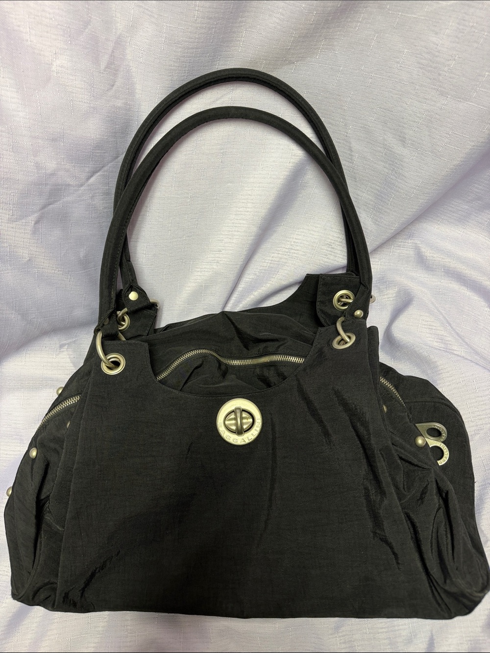 Black Baggallini Bag with Silver Hardware & lots of compartments.